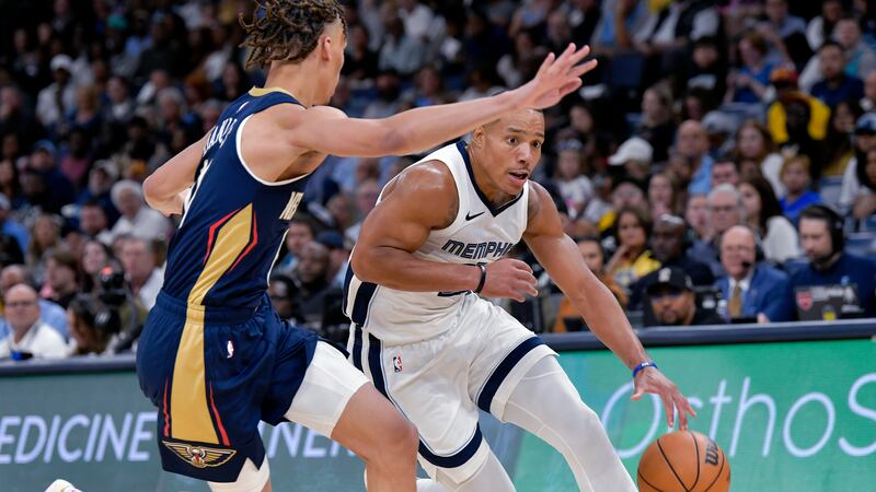 Memphis Grizzlies guard Desmond Bane, right, drives against New Orleans Pelicans guard Dyson...