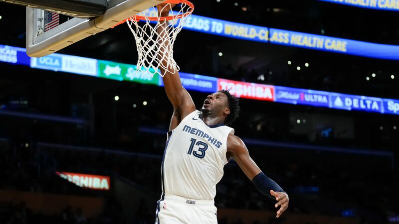 Memphis Grizzlies forward Jaren Jackson Jr. (13) dunks during the first half of an NBA...