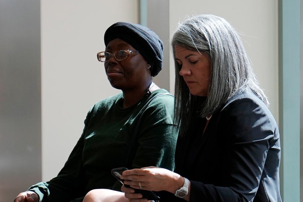 Sheneen McClain, mother of Elijah McClain, sits with Colorado Solicitor General Shannon...