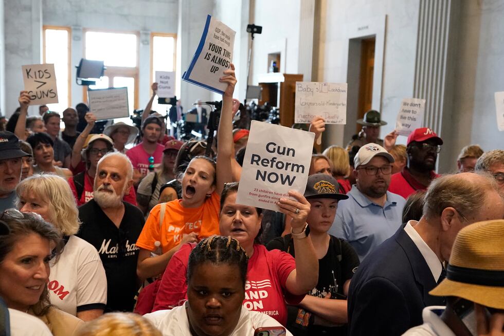 Demonstrators yell for gun reform laws in the lobby outside the legislative chambers of the...