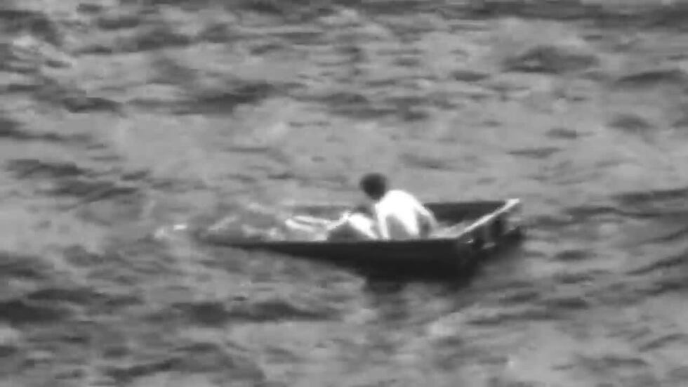 Crews rescued Charles Gregory after his small boat capsized and he was swept out to sea 12...