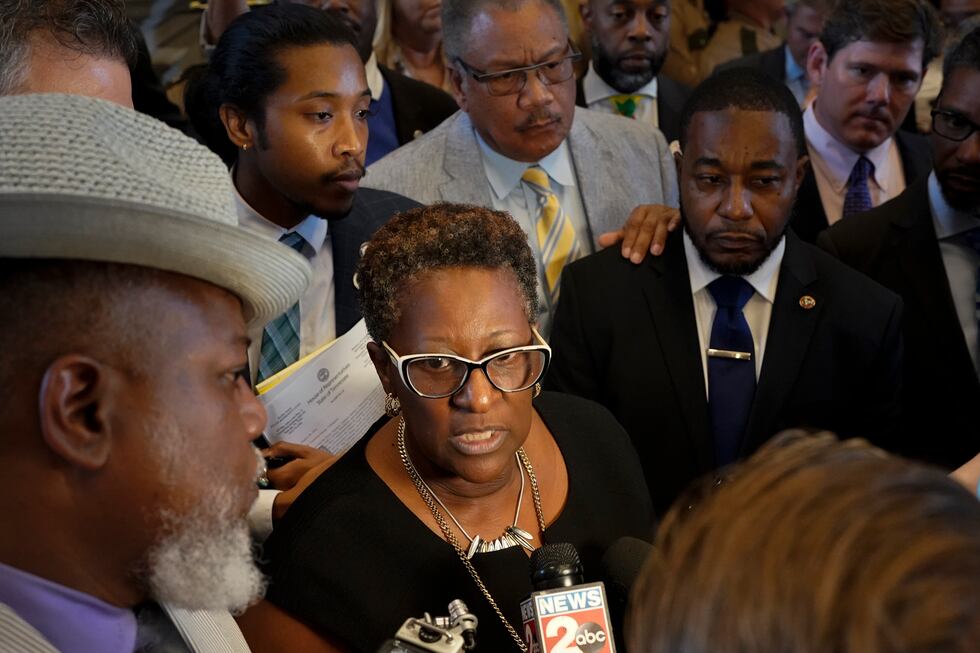 Rep. Karen Camper, D-Memphis, speaks to reporters outside the House chamber with fellow...