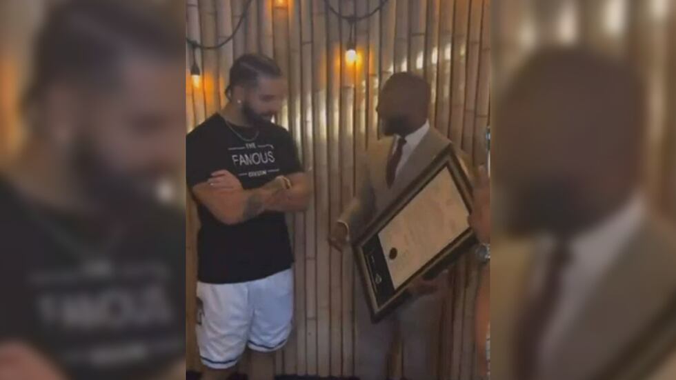 Shelby County Commissioner Mickell Lowery presents Drake with a key to Shelby County