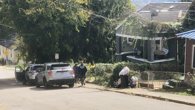 Police respond to a home on Adele Street in Charleston after a woman's body was found October 4.