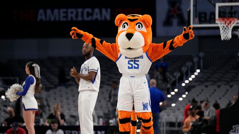 The Memphis mascot, Pouncer, motivates fans during an NCAA college basketball game against...